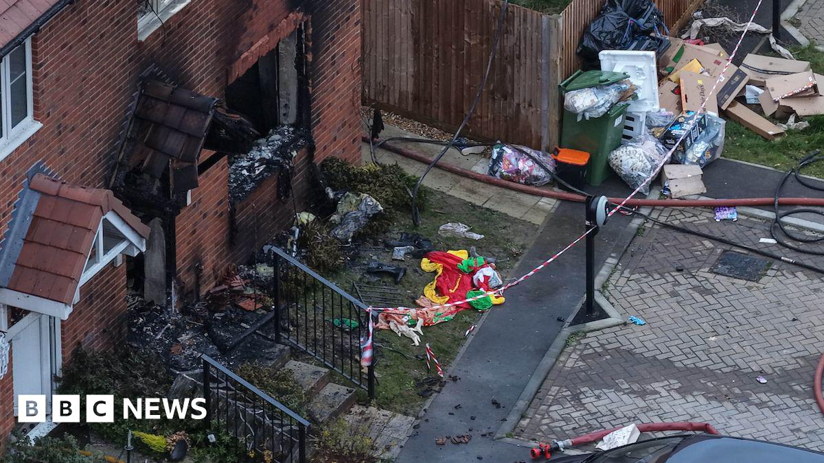 A burnt-out front of a house.