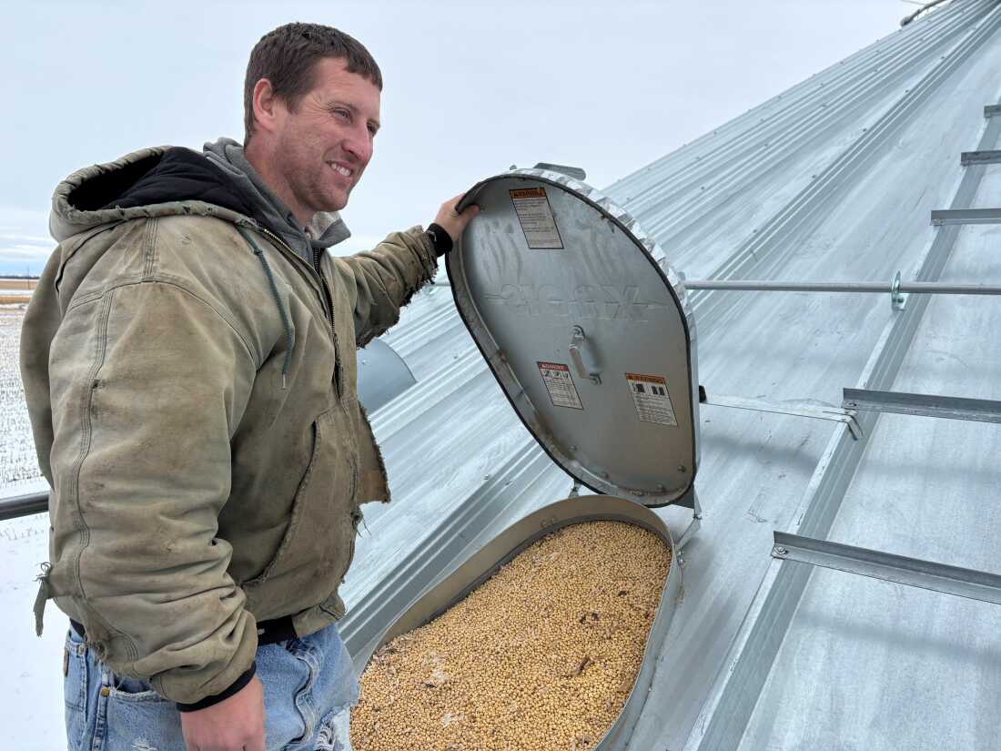 Soybean farmers like Kevin Deinert have grain bins full of beans