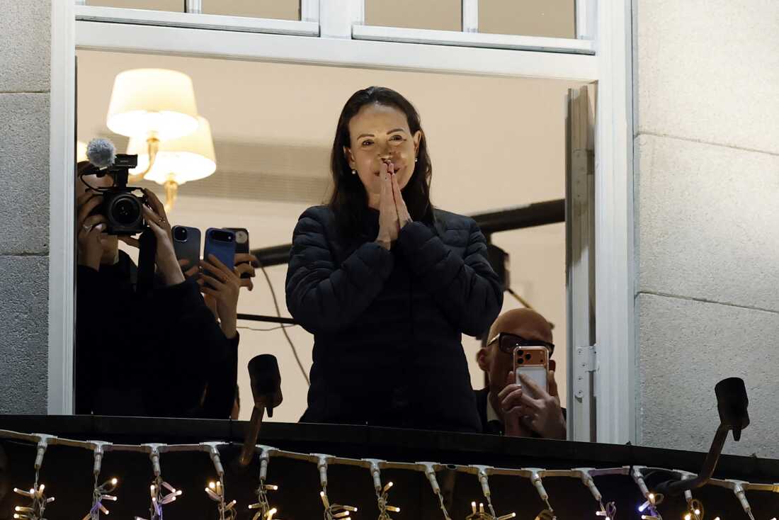 Nobel peace laureate Maria Corina Machado greets supporters from a balcony of the Grand Hotel in Oslo, Norway, in the early hours of Dec 11, 2025.