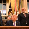 President Trump, center, and Secretary of Commerce Howard Lutnick, right, listen as U.S. Sen Ted Cruz, R-Tex. speaks during a signing ceremony for an executive order on AI at the White House on Dec. 11, 2025.
