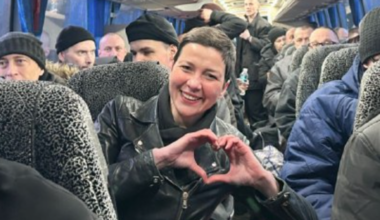 Maria Kolesnikova, making her trademark heart sign, on a coach with released prisoners arriving in Ukraine. Pic: Coordination Headquarters for the Treatment of Prisoners of War/AP