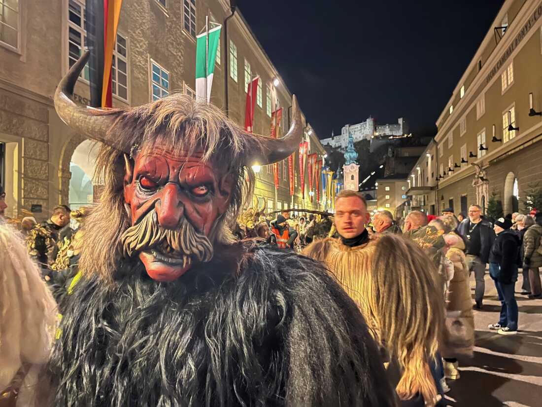 After a city bus drops off more than 200 Krampuses at the entrance to the old town of Salzburg, the Krampuses start to put their masks on and get into character.