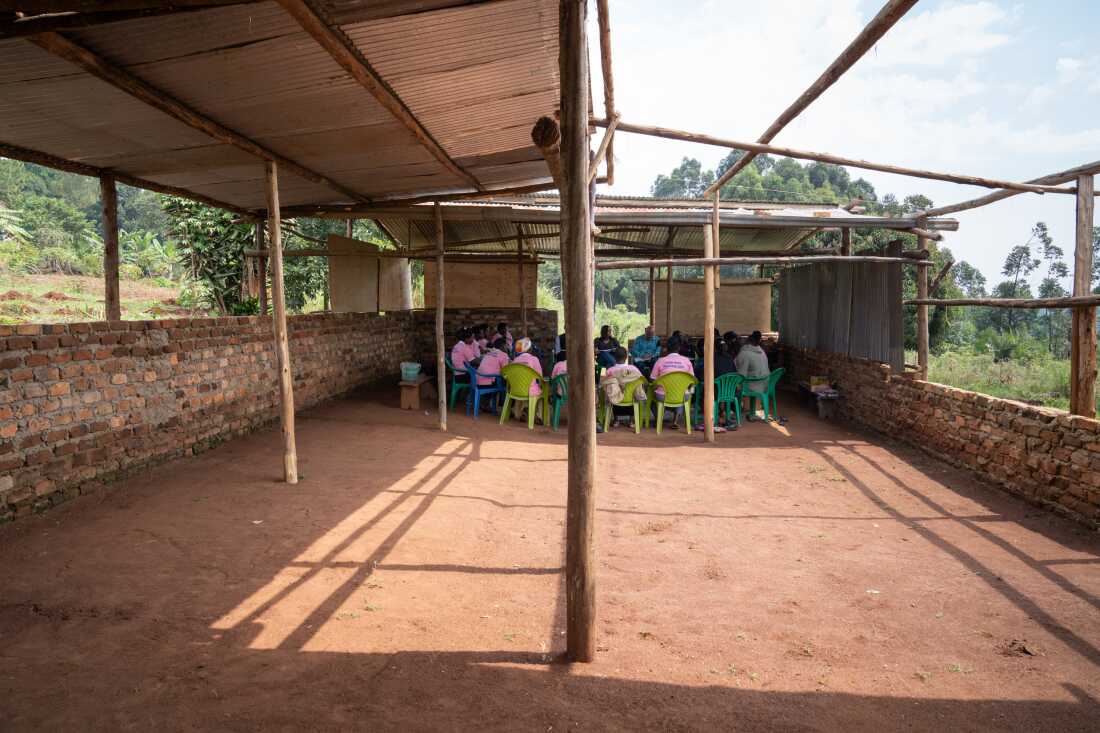 In the remote Uganda village of Kakoni. economist Dean Karlan and staff from the AVSI Foundation meet with members of one of many groups who can borrow from a block grant to help build a business. Each group sets its own rules, including borrowing limits, the interest rate and deadlines for repaying loans.