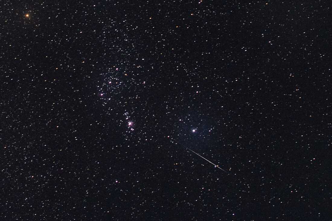 This photo taken late Dec. 14, 2018, with a long time exposure shows a meteor streaking through the night sky over Myanmar during the Geminids meteor shower seen from Wundwin township near Mandalay city.