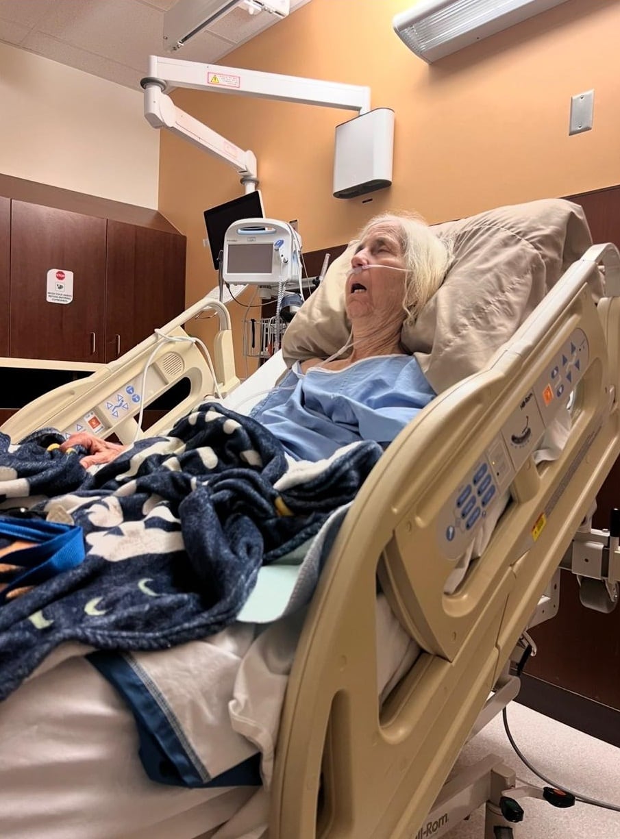 Elderly woman sleeping in a hospital bed