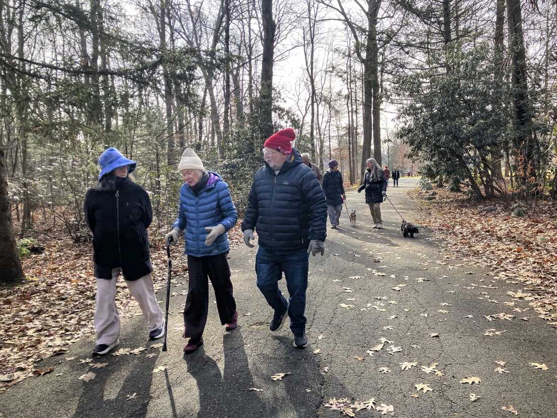 Maureen Cahillane, center, walks with her bereavement group on November 21 in Northampton, Mass.