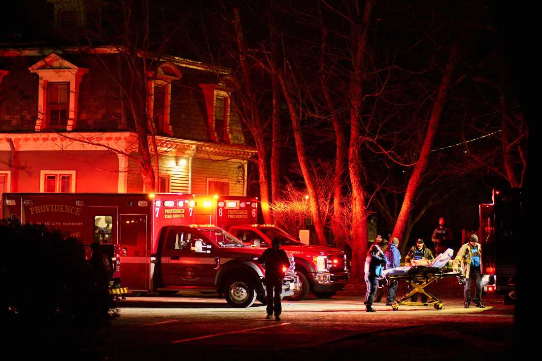 First responders with the Providence Fire Department maneuver an empty stretcher near the Barus and Holley building at Brown University in Providence, R.I., on Saturday.