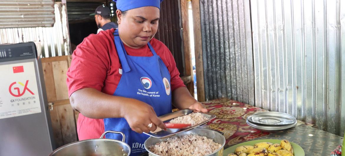 A school cook in Timor-Leste prepares food using local ingredients.