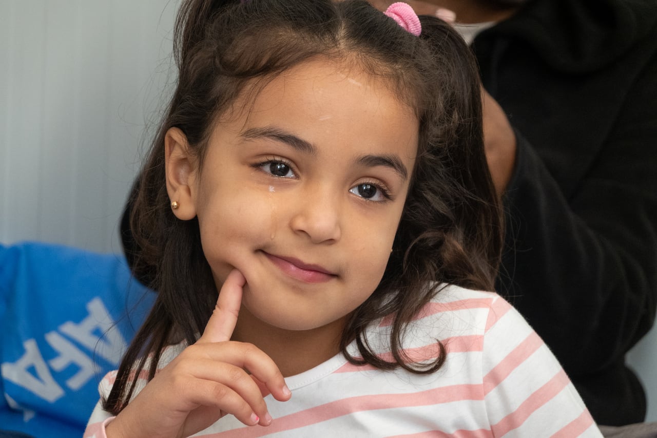 Sila Hammouda, 8, sits in a temporary housing unit in Adana, Turkey. Her family was evacuated from Gaza, so her father could receive medical treatment abroad.