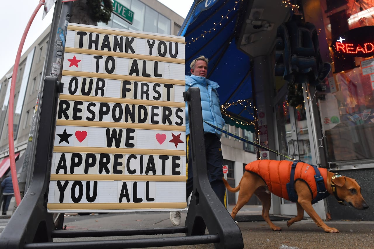A street sign shows a thank you message to first responders