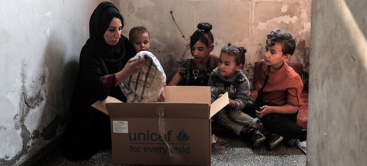 UNICEF distributes winter clothes kits to children across the Gaza Strip, as winter storms are adding to families’ hardship.