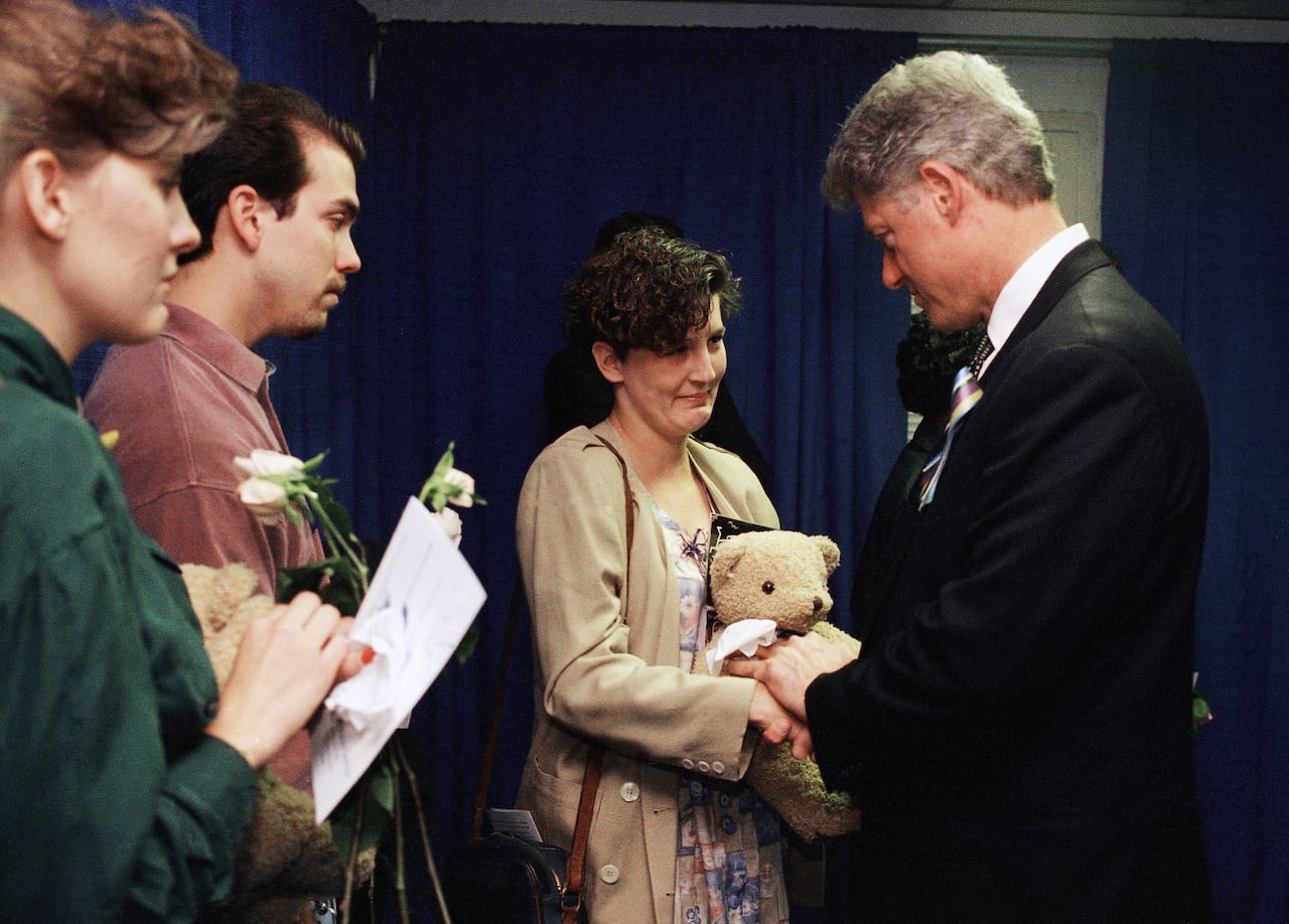 Aren Almon greets President Bill Clinton after a prayer service for the victims of the deadly truck bomb attack in Oklahoma City on April 23, 1995.