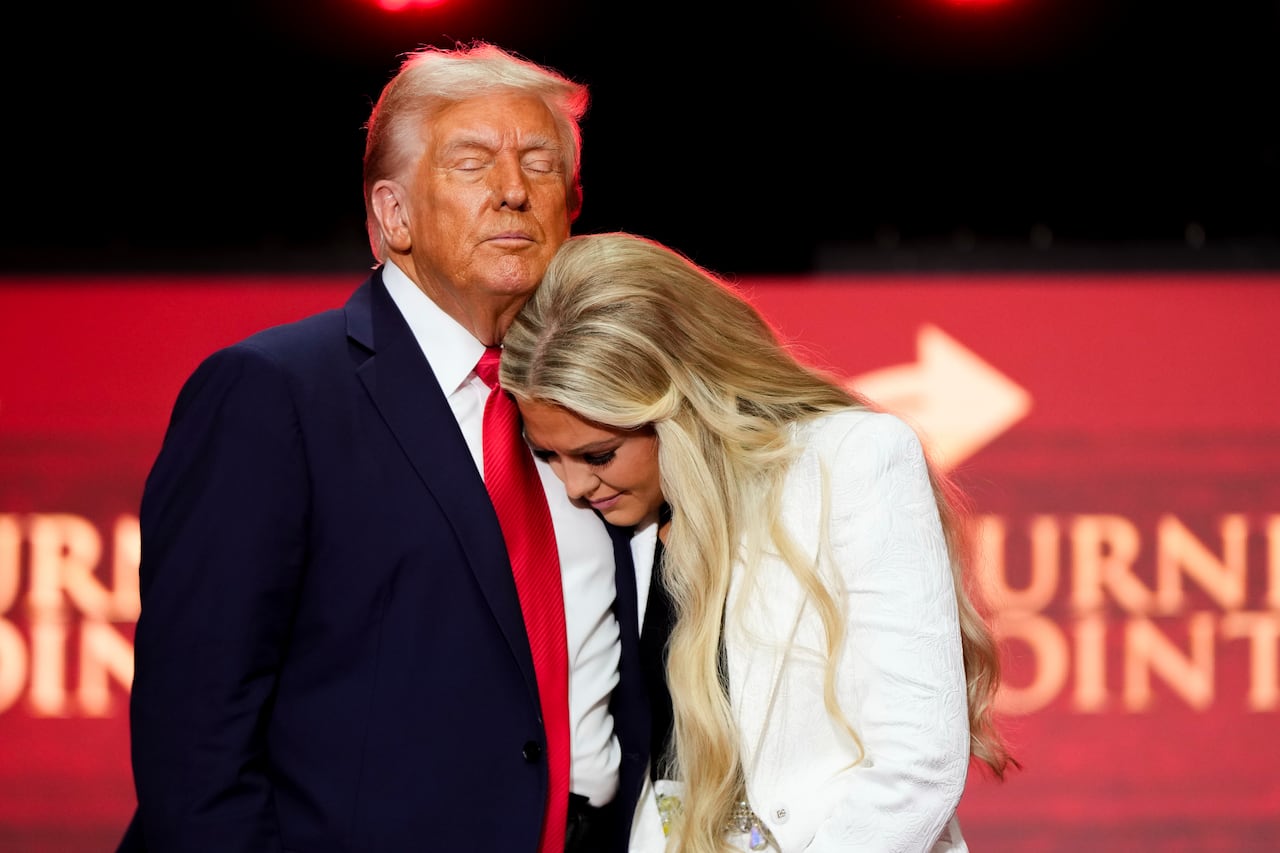 President Donald Trump hugs Erika Kirk at the conclusion of a memorial for her husband, conservative activist Charlie Kirk, Sunday, Sept. 21, 2025, at State Farm Stadium in Glendale, Ariz.