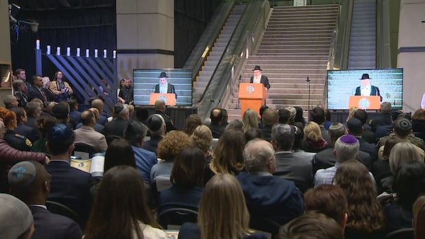 ‘We have to spread light’: Calgary Jews light menorah at city hall in wake of Sydney shooting