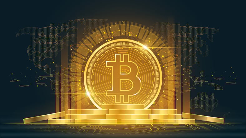 Bitcoin logo with gold backdrop.
