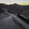 From an aerial view, the U.S.-Mexico border fence ends with a gap on Jan. 20, 2025 near Sasabe, Ariz. Republicans' tax and spending bill includes $46.5 billion for border wall projects.