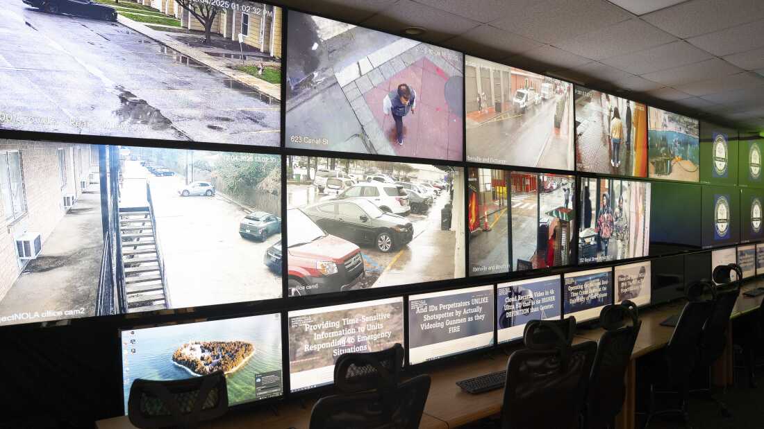 A wall of screens displays feeds from Project NOLA’s extensive crime camera network, spanning the length of a room at the nonprofit’s headquarters in New Orleans.