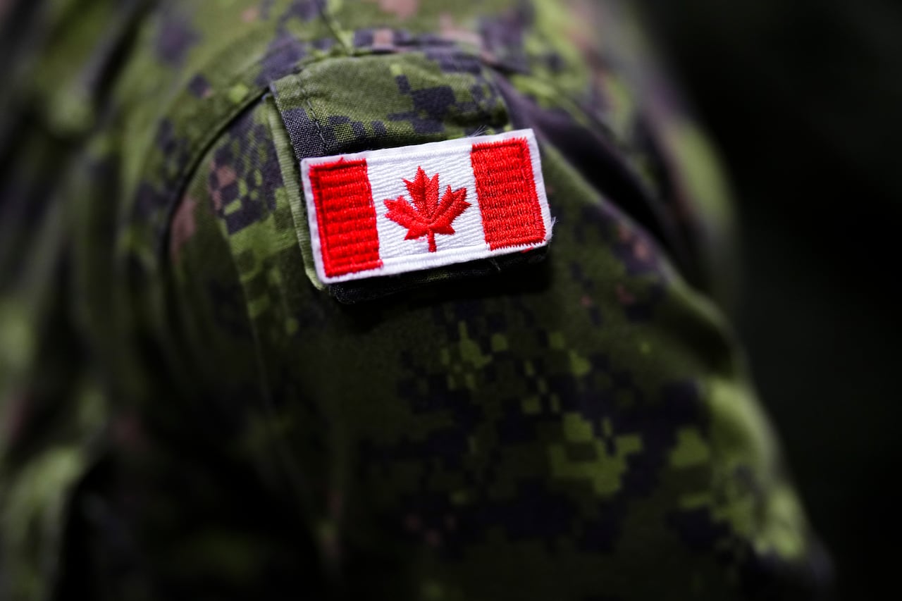 Canadian flag on soldier's uniform.