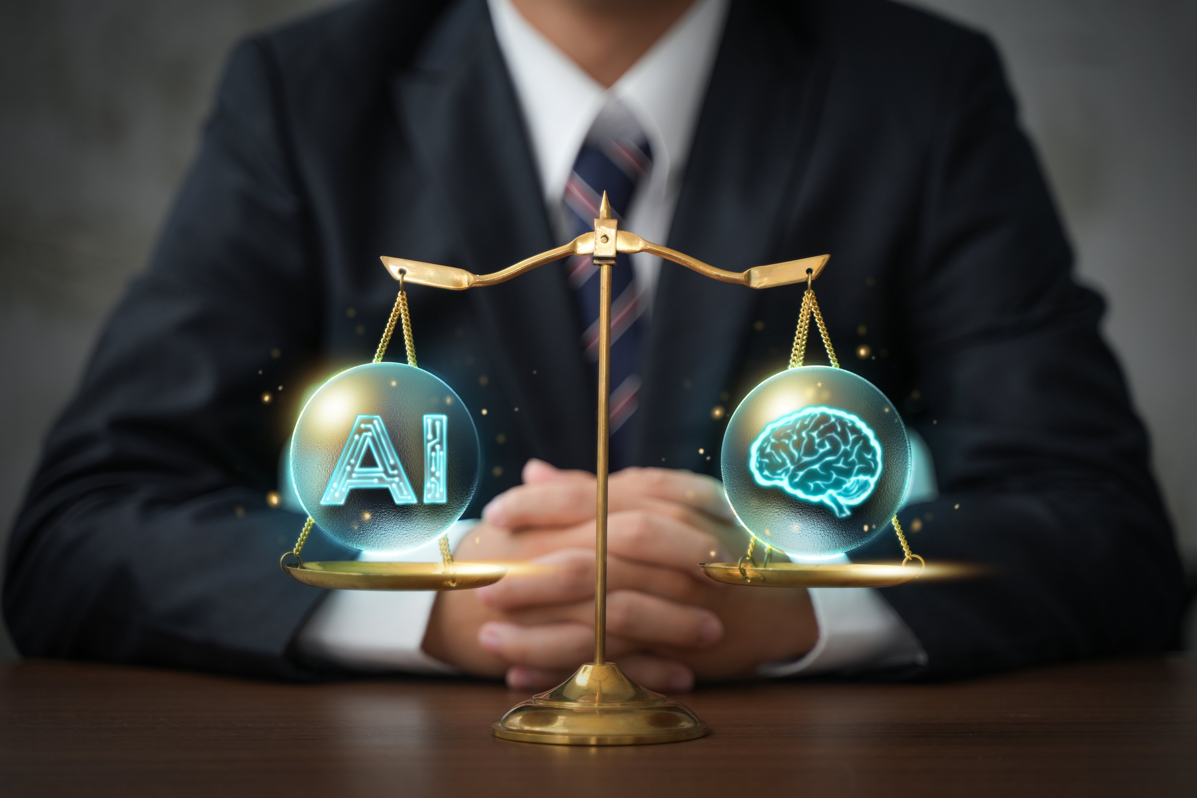 A business person sits facing a balanced scale with AI on one pan and human intelligence on the other. 