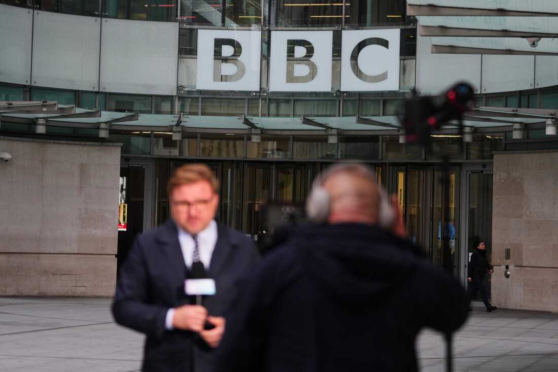 Journalists report outside BBC Broadcasting House in London. In a new lawsuit, President Trump is seeking $10 billion from the BBC for defamation.
