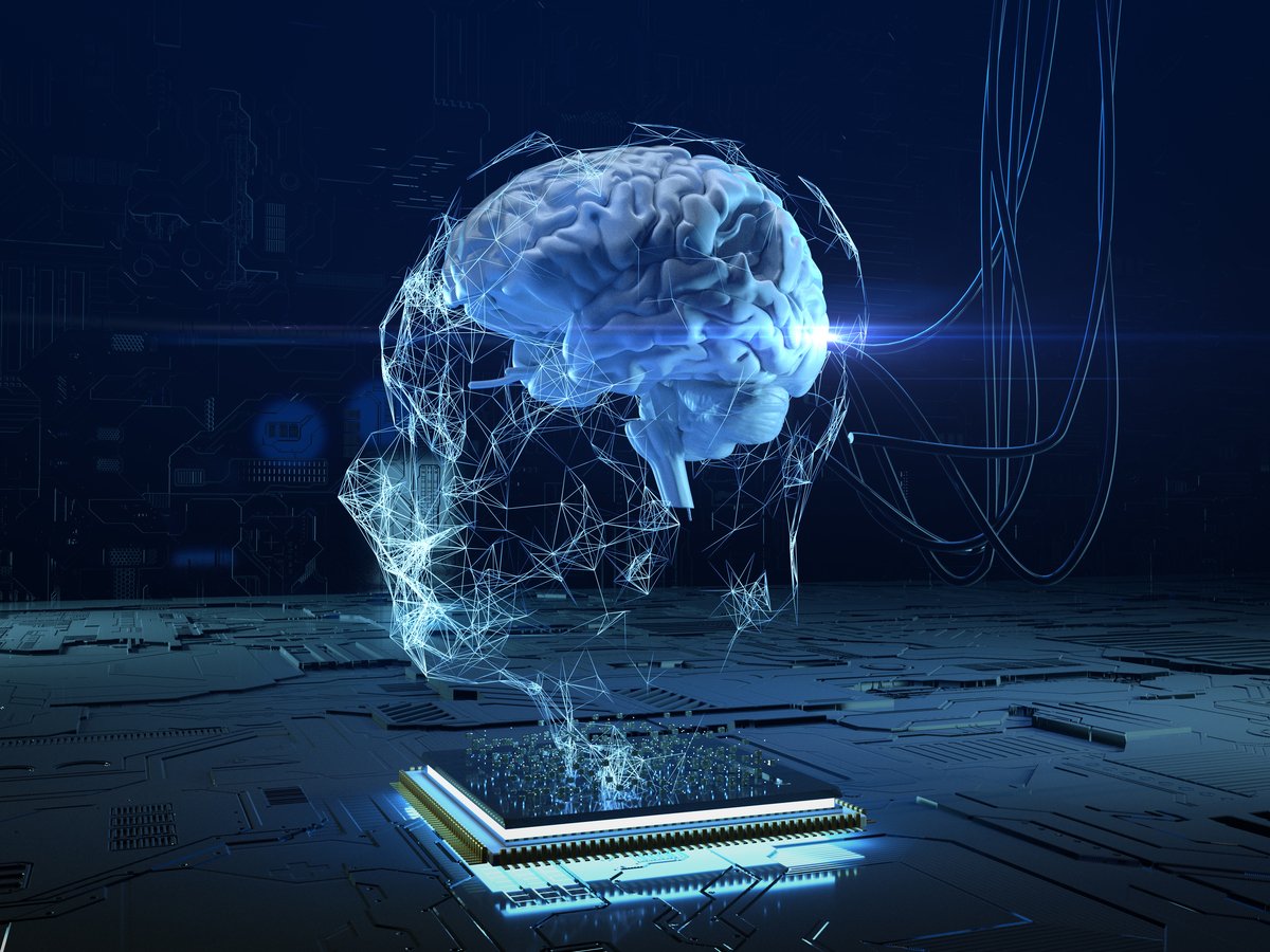 A digital image of a brain hovers above a computer chip.