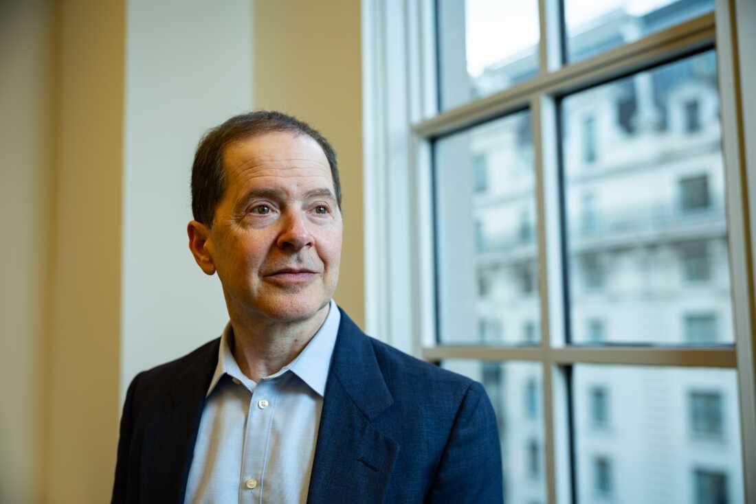 Max Stier poses for a portrait in the office of the Partnership for Public Service, of which he is president and CEO, on December 11, 2025 in Washington, D.C. Credit: Maansi Srivastava for NPR