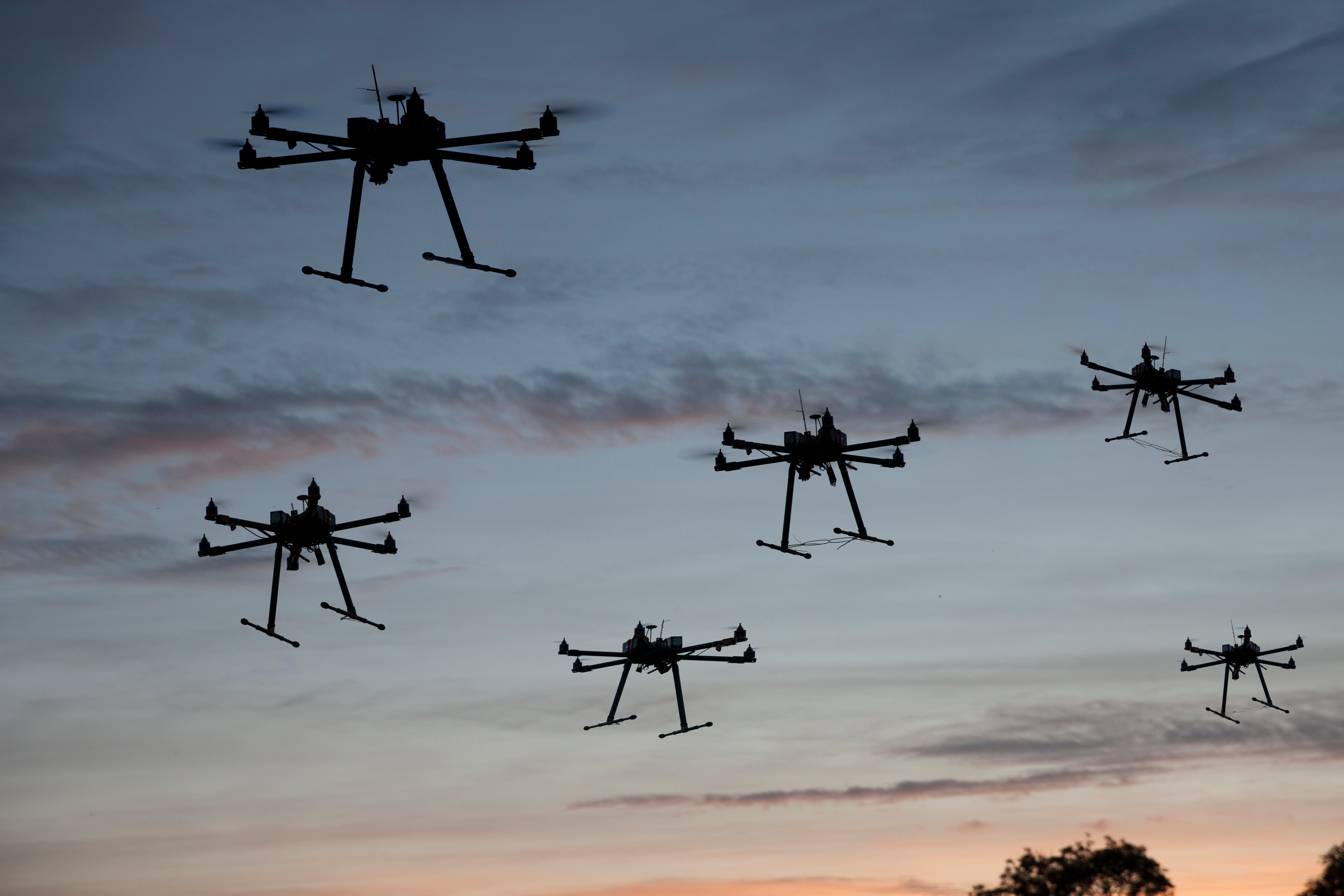 Hexacopter drones flying in the air.