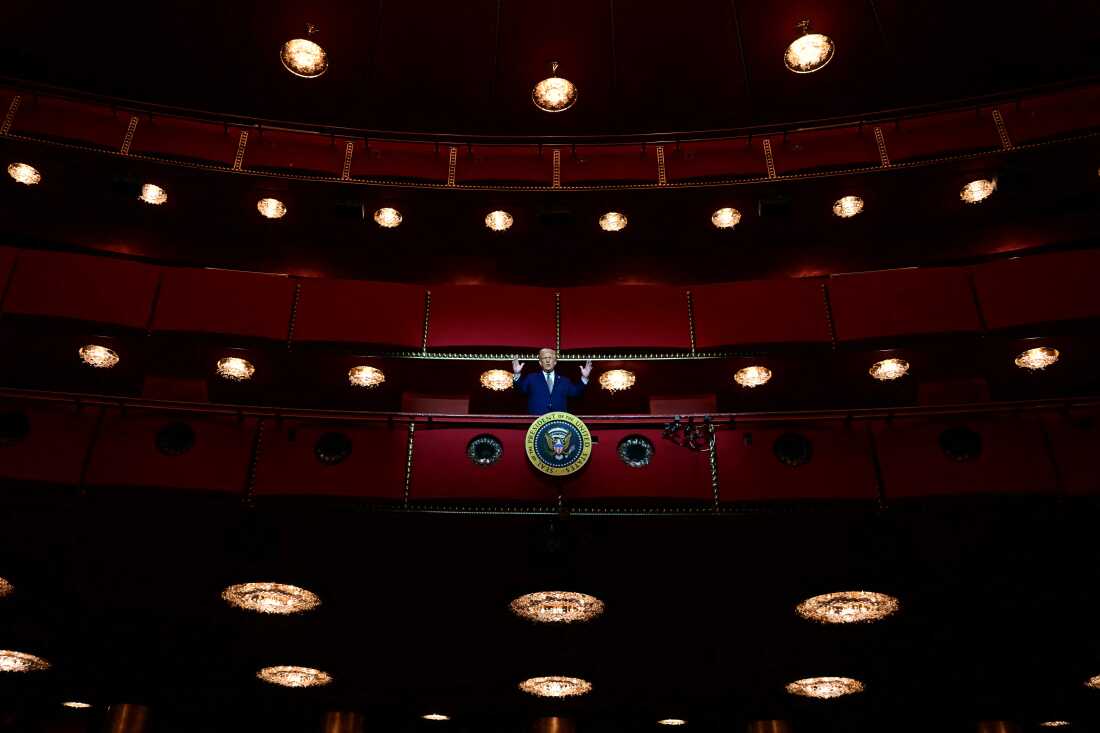 TOPSHOT - US President Donald Trump stands in the presidential box as he visits the John F. Kennedy Center for the Performing Arts in Washington, DC, on March 17, 2025. US President Donald Trump is visiting the Kennedy Center in Washington for the first time since his stunning takeover of the top arts venue that he branded too "woke." Trump will lead a board meeting at the venue, where he installed himself as chairman and ousted the leadership a month ago as part of his broader blitz on almost every aspect of American life. (Photo by Jim WATSON / AFP) (Photo by JIM WATSON/AFP via Getty Images)