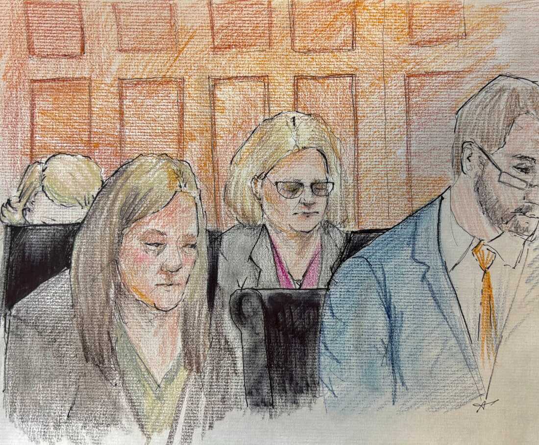 Milwaukee County Circuit Judge Hannah Dugan, center, depicted in a court sketch as jury selection in her trial begins in Milwaukee, Wis.