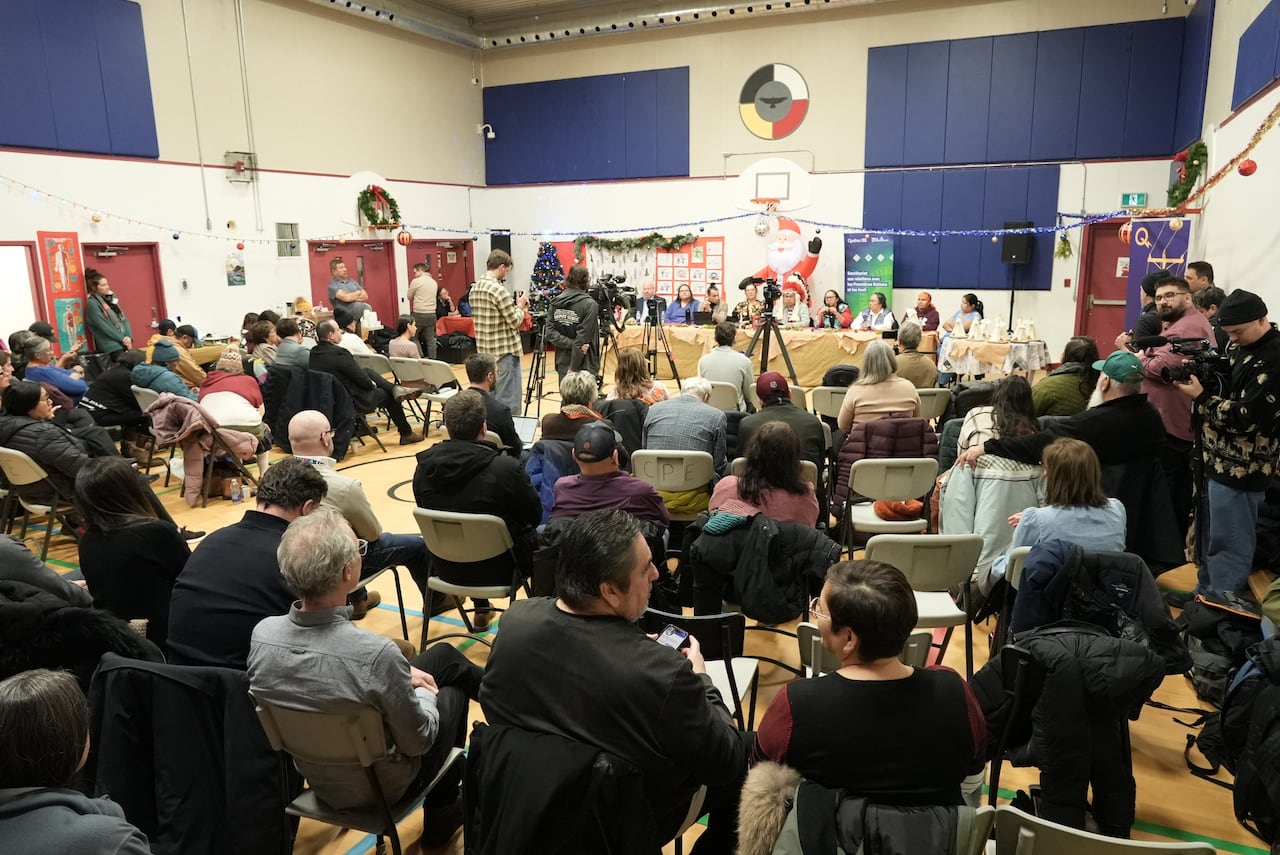 A group of people sitting in chairs