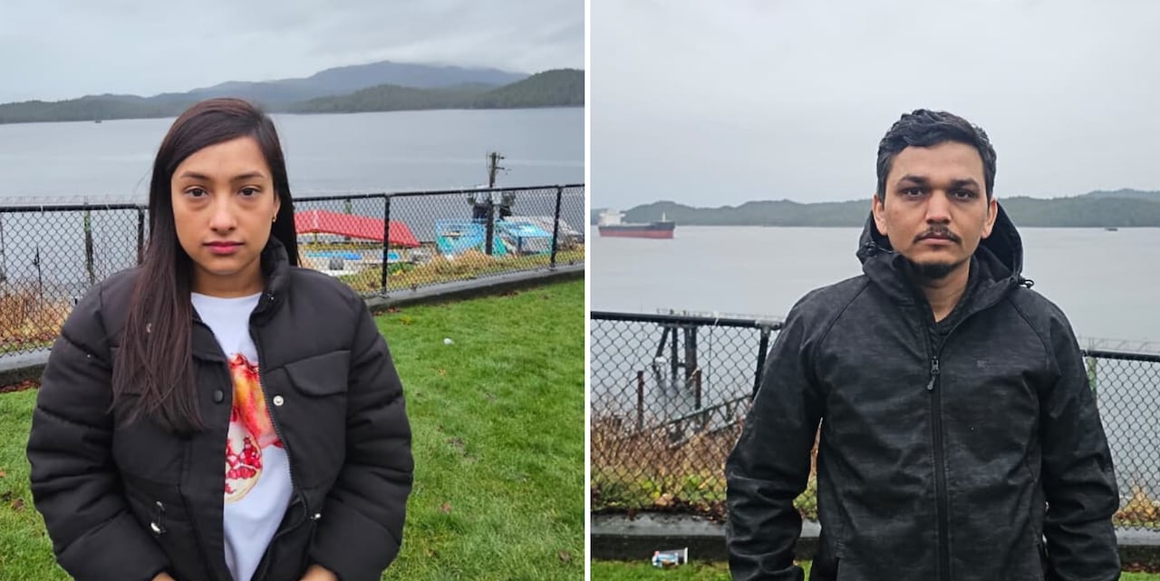 Two sad people in front of the ocean.