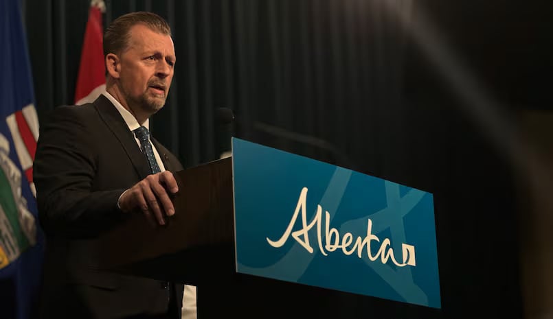 A man stands behind a podium.