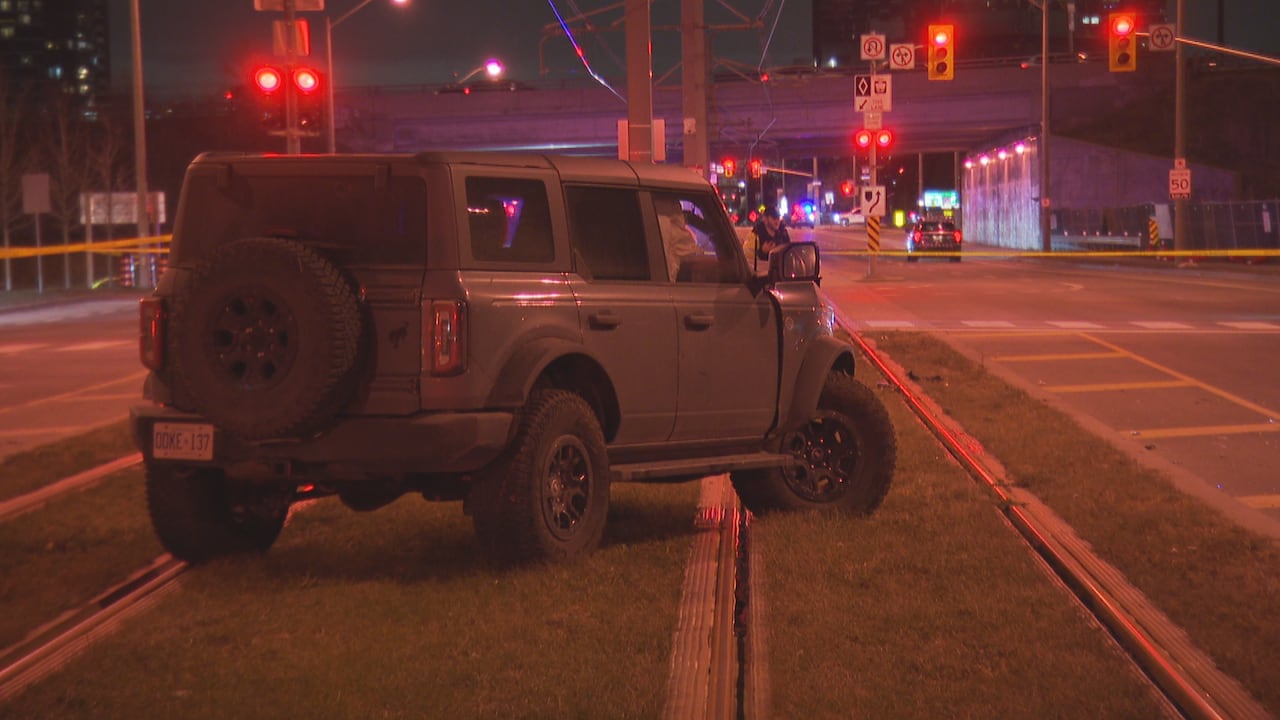 Car on light-rail transit tracks