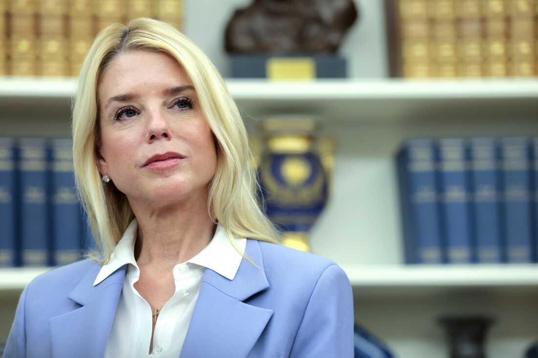 Attorney General Pam Bondi stands in the Oval Office in May 2025.