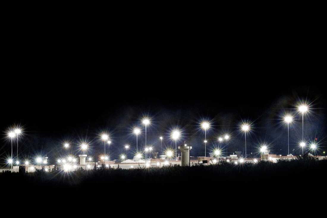 A view of ADX Florence at night, where there are many bright lights over the facility, in 2019. 