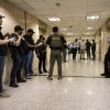 Federal agents wait outside an immigration courtroom at the Jacob K. Javits Federal Building in New York on June 10, 2025.