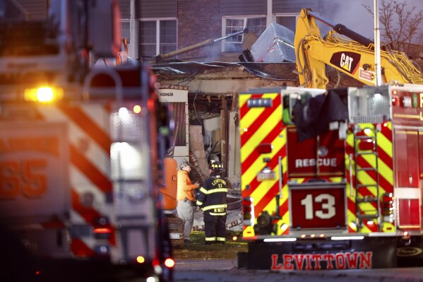 First responders work the scene of an explosion and fire at Bristol Health & Rehab Center, Tuesday, Dec. 23, 2025, in Bristol Township, Pa. (Monica Herndon/The Philadelphia Inquirer via AP)