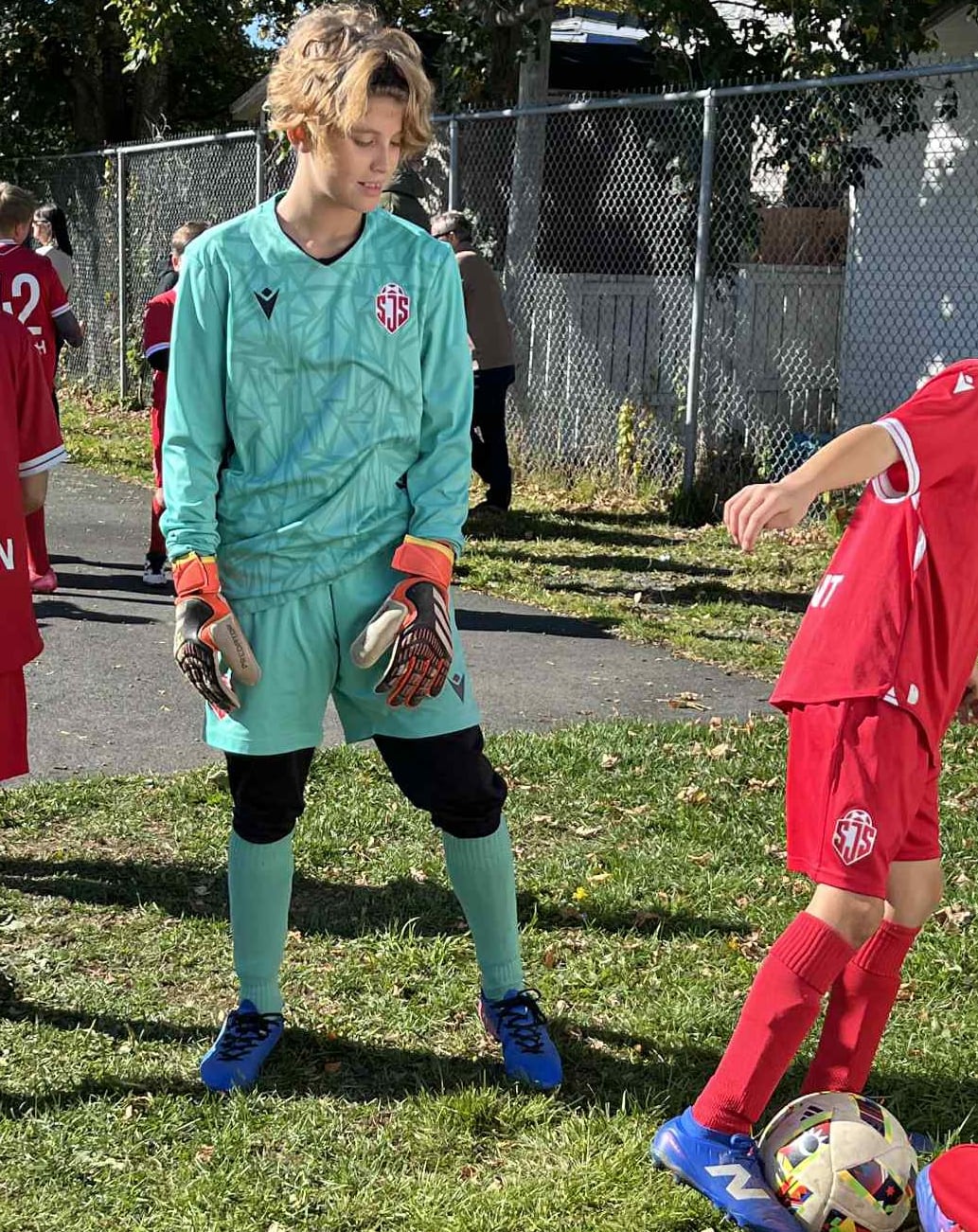 A boy in a soccer uniform