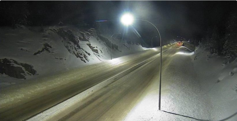 A snowy stretch of highway.