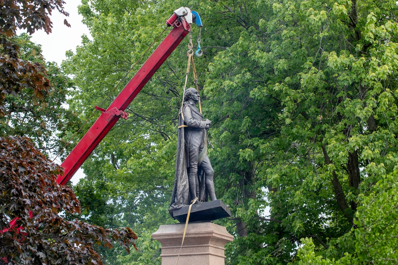 The statue of Sir John A Macdonald is removed in Kingston, Ont. on Friday June 18, 2021.