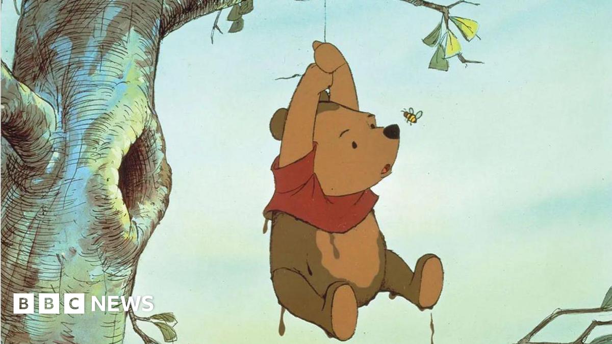 Illustration of Winnie the Pooh hanging by a rope from a tree with a perturbed look on his face