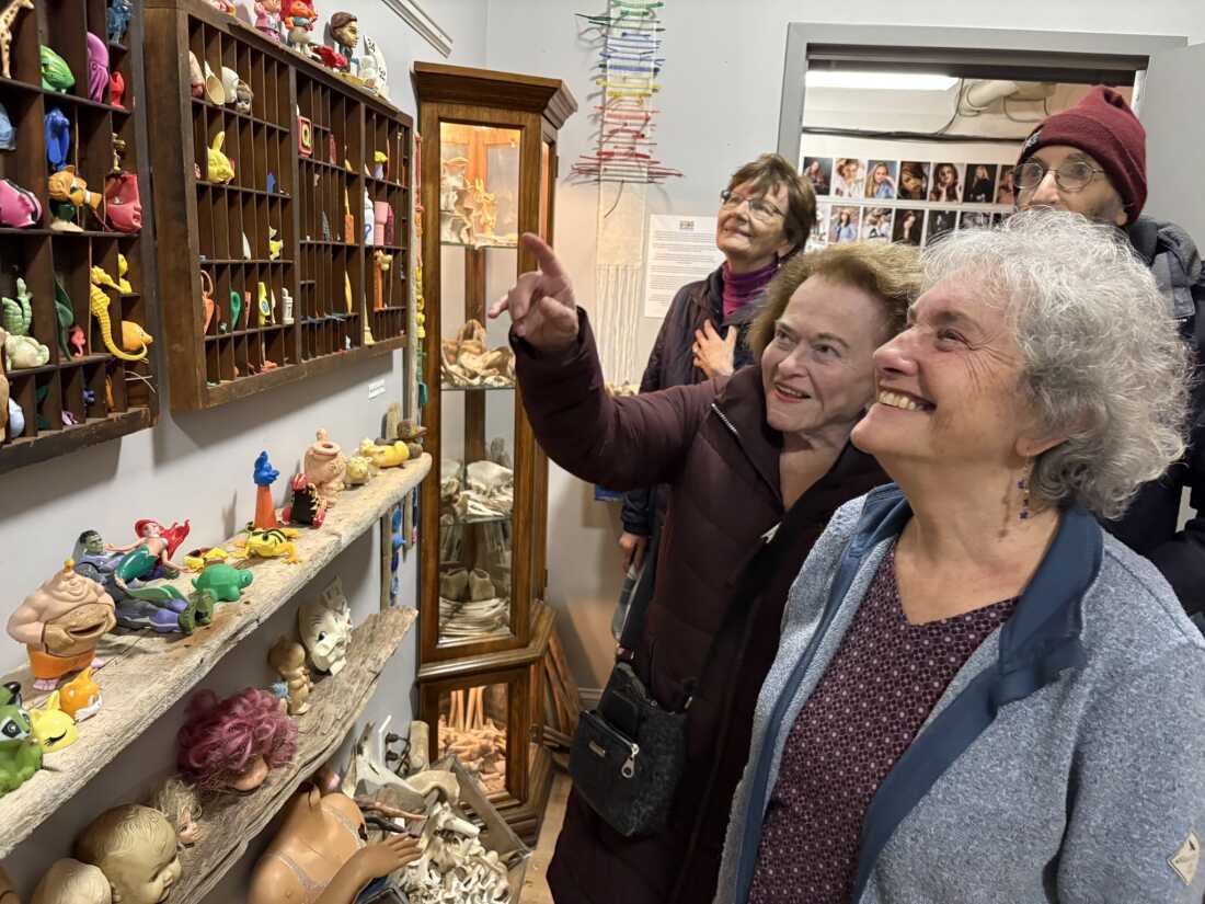 Elayne Byrne (pointing) and Sharon Wintner (right) were among the visitors recently exploring the Plum Island Museum of Lost Toys & Curiosities.