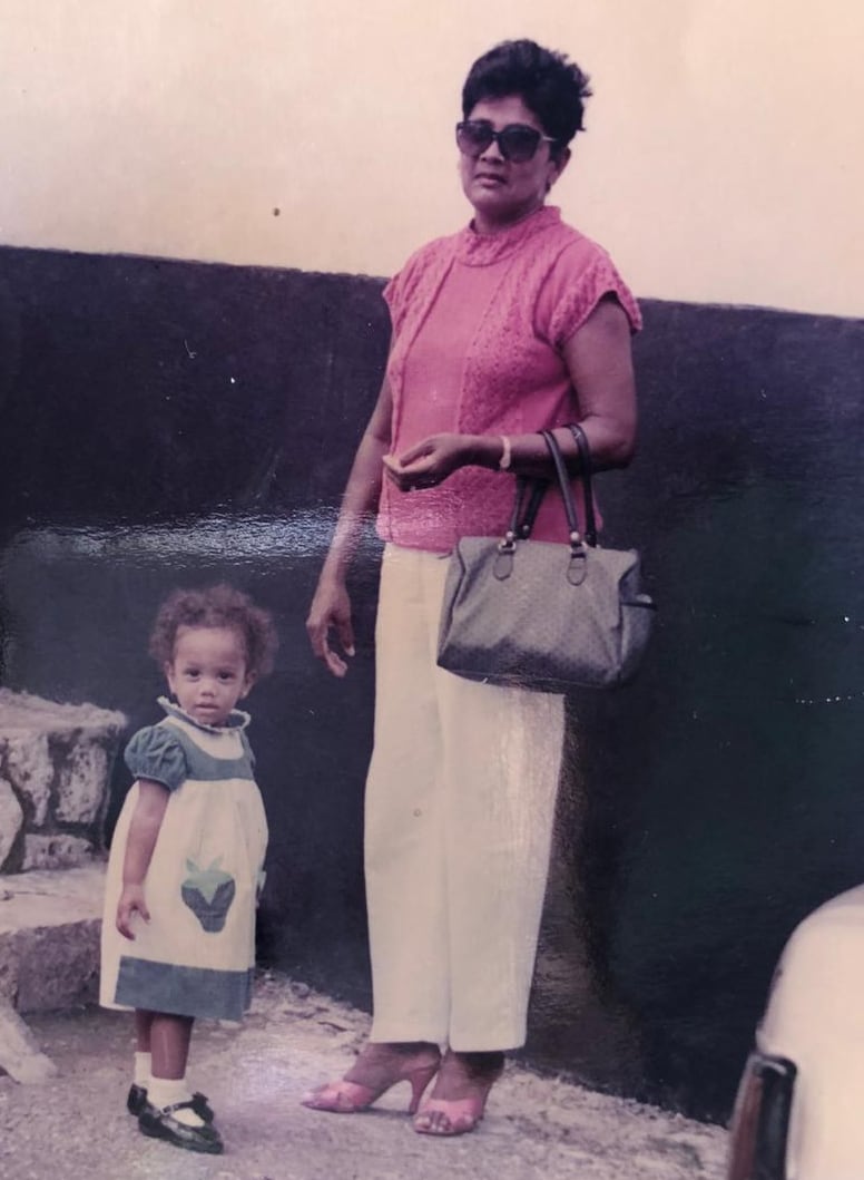 Jody-Anne when she was a young girl, standing next to her grandmother.