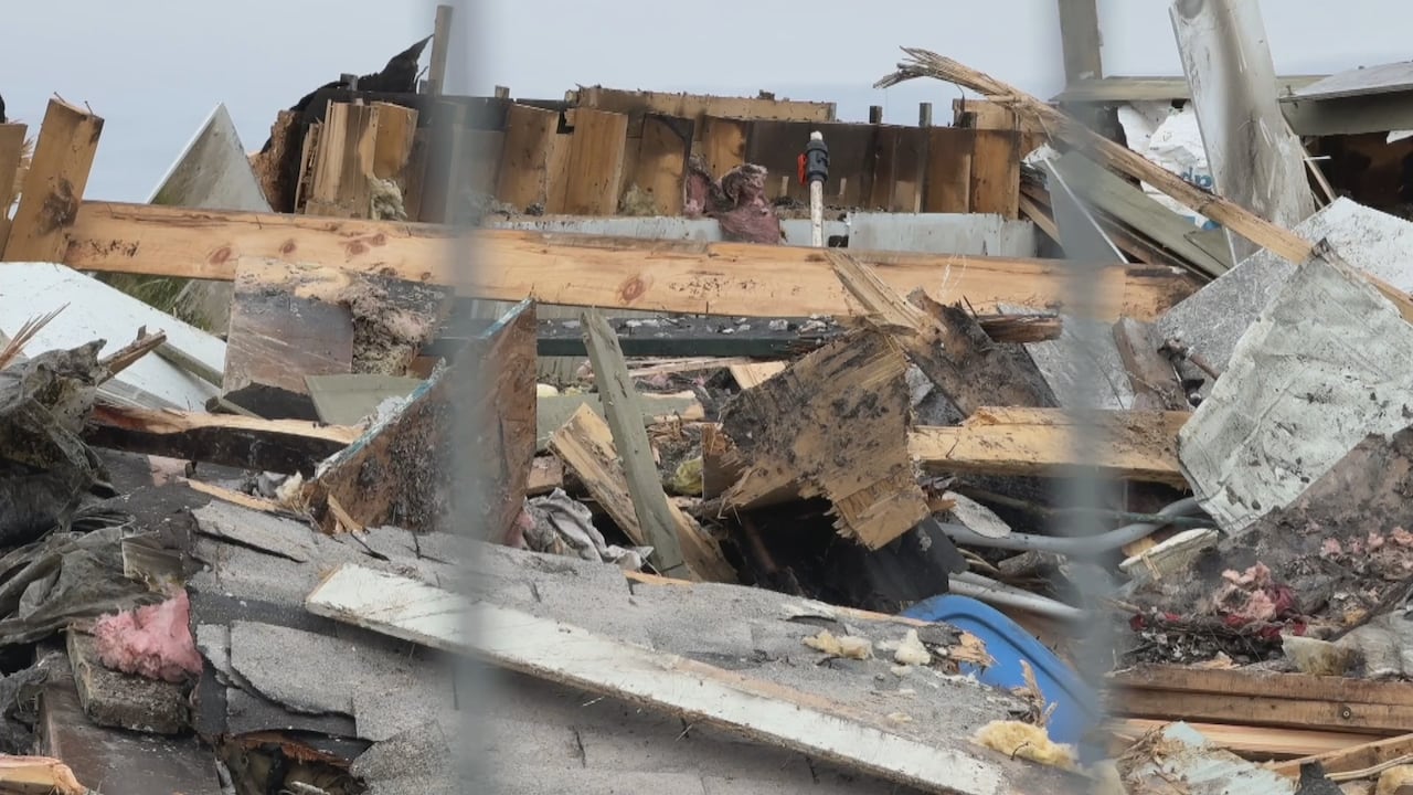 A pile of rubble is shown after a fire burned a building down.