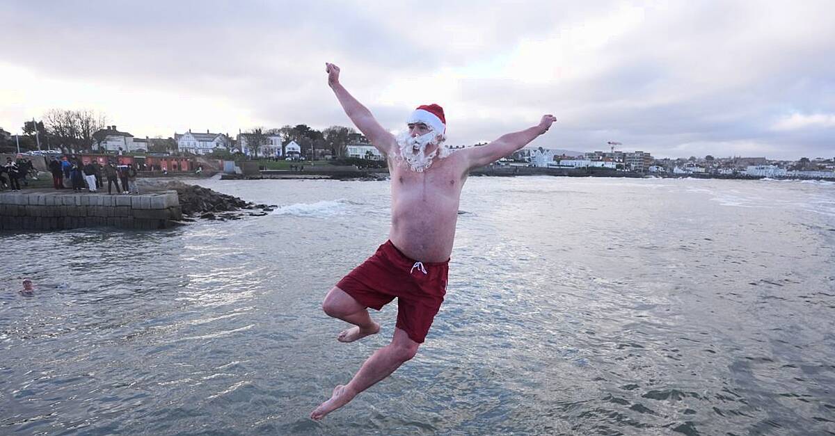 Crowds brave chilly temperatures for Christmas Day swim