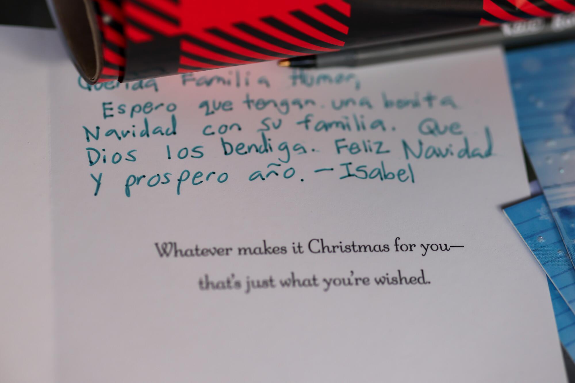 A Christmas card addressed to an immigrant family during an angel tree event.