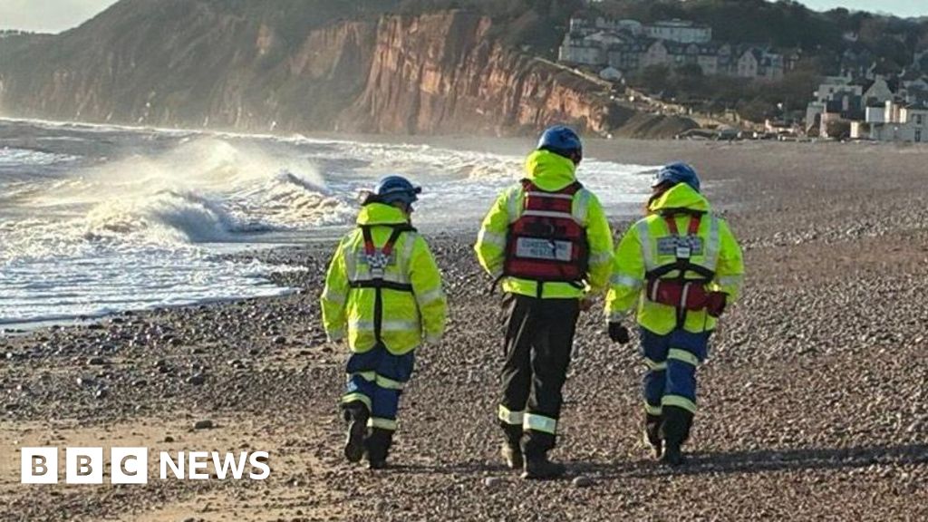 Search for two men missing after Christmas Day swim called off