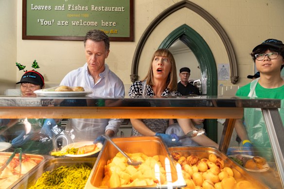Premier Chris Minns and Summer Hill MP Jo Haylen serve food on Christmas Day.