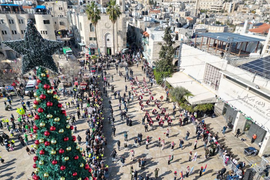 An aerial view shows scouts marching on Wednesday during Christmas Eve celebrations on Manger Square outside the Church of the Nativity in Bethlehem.