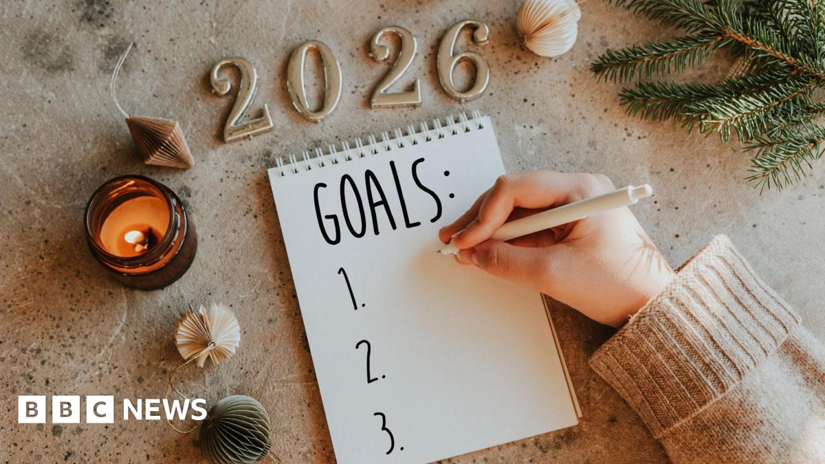 Woman's hand writing goals 2026 for New Year. New Year Routine